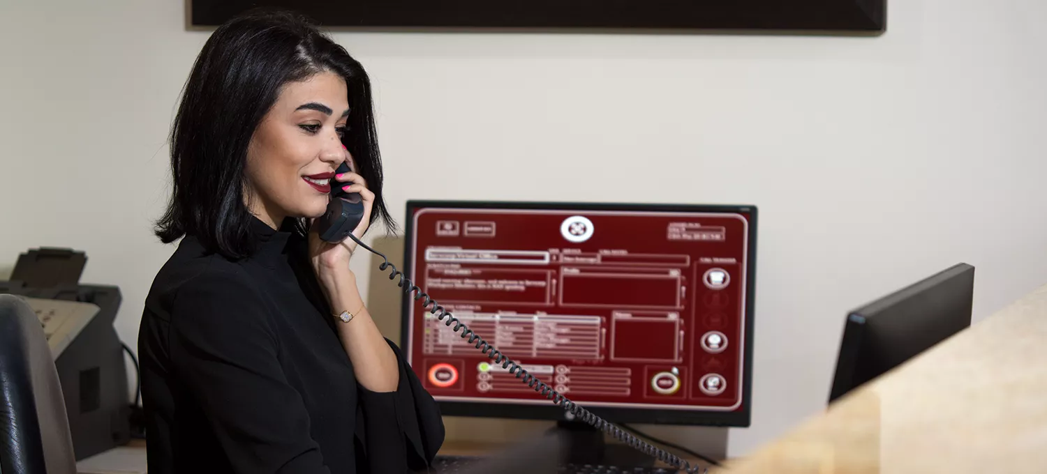 Servcorp receptionist answering and transferring calls professionally.